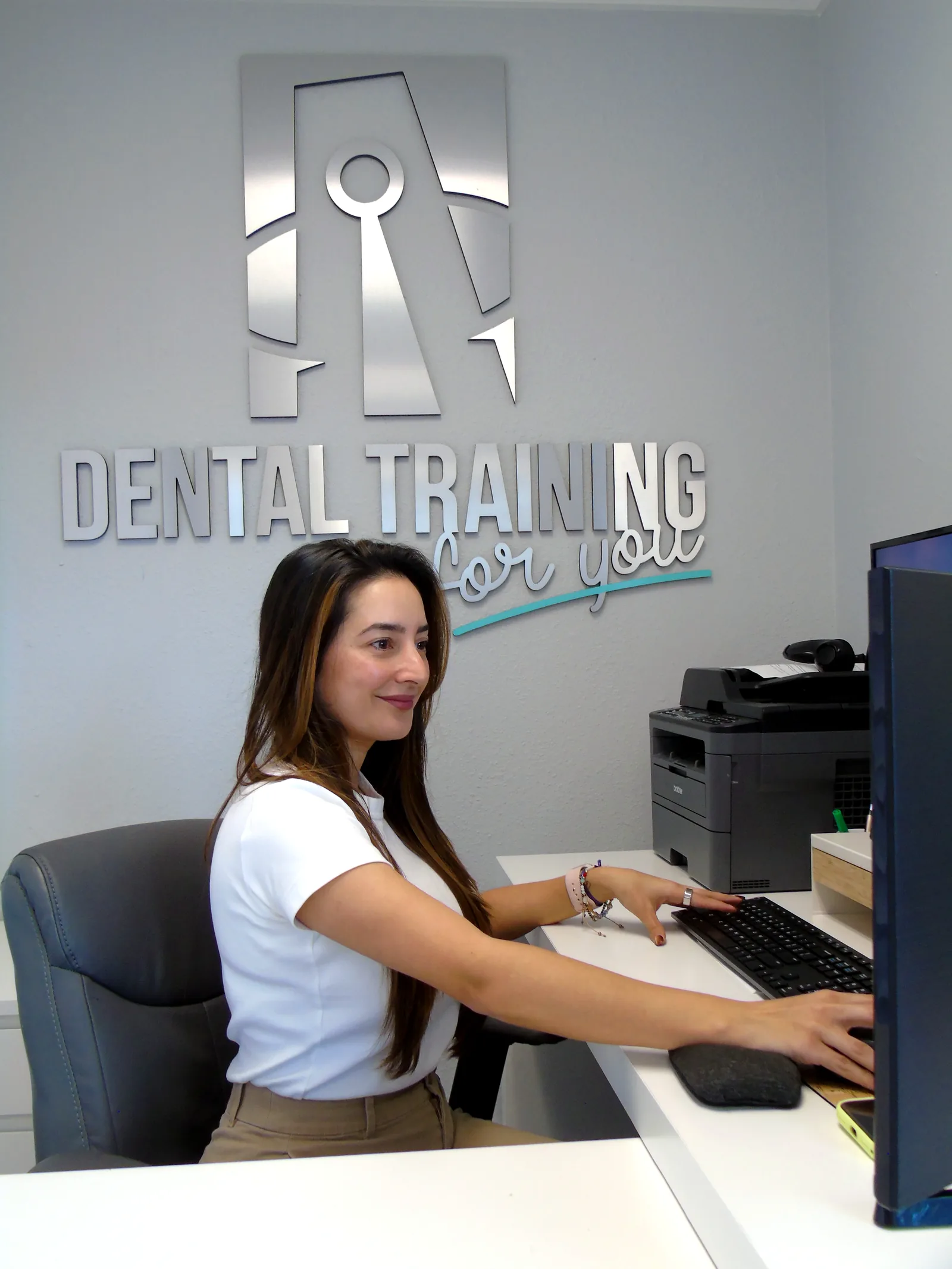 Student completing dental administrative training online